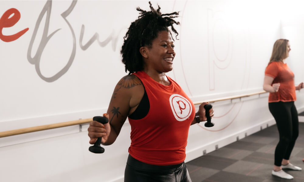 Two people working out with dumbbells